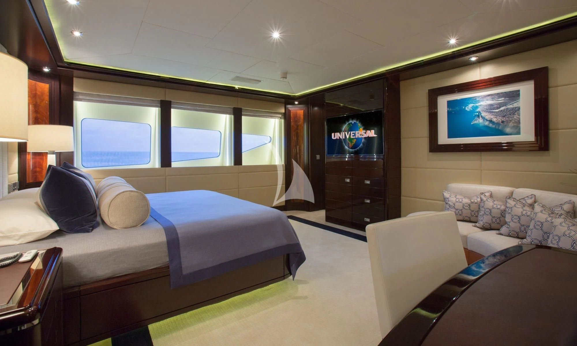 a room with a bed and a television aboard DREAM Yacht for Sale