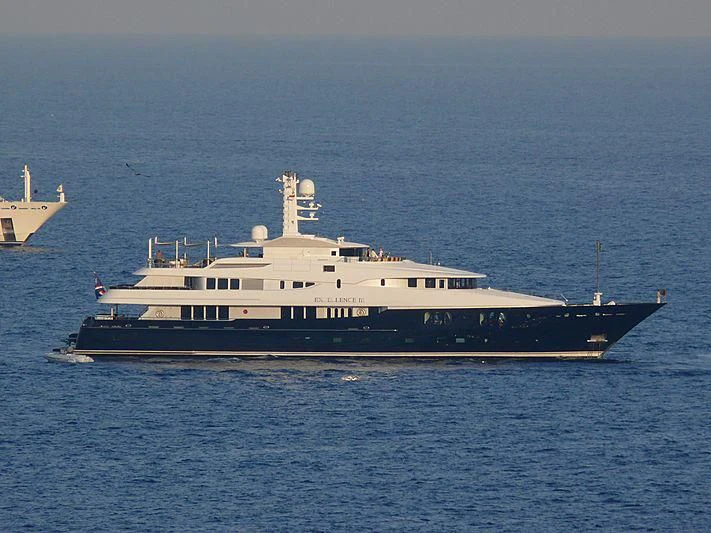 a large ship in the water aboard DREAM Yacht for Sale