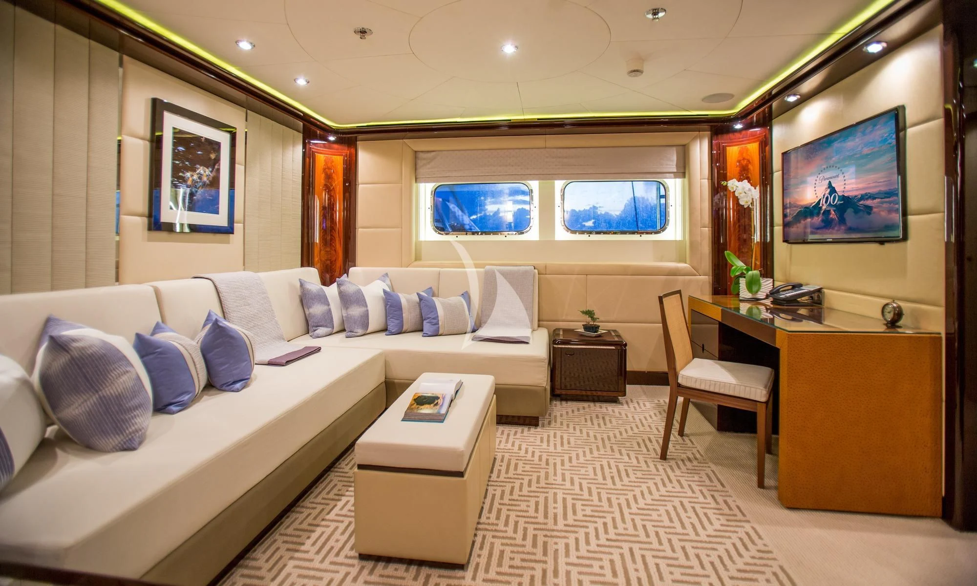 a room with a couch and a tv aboard DREAM Yacht for Sale