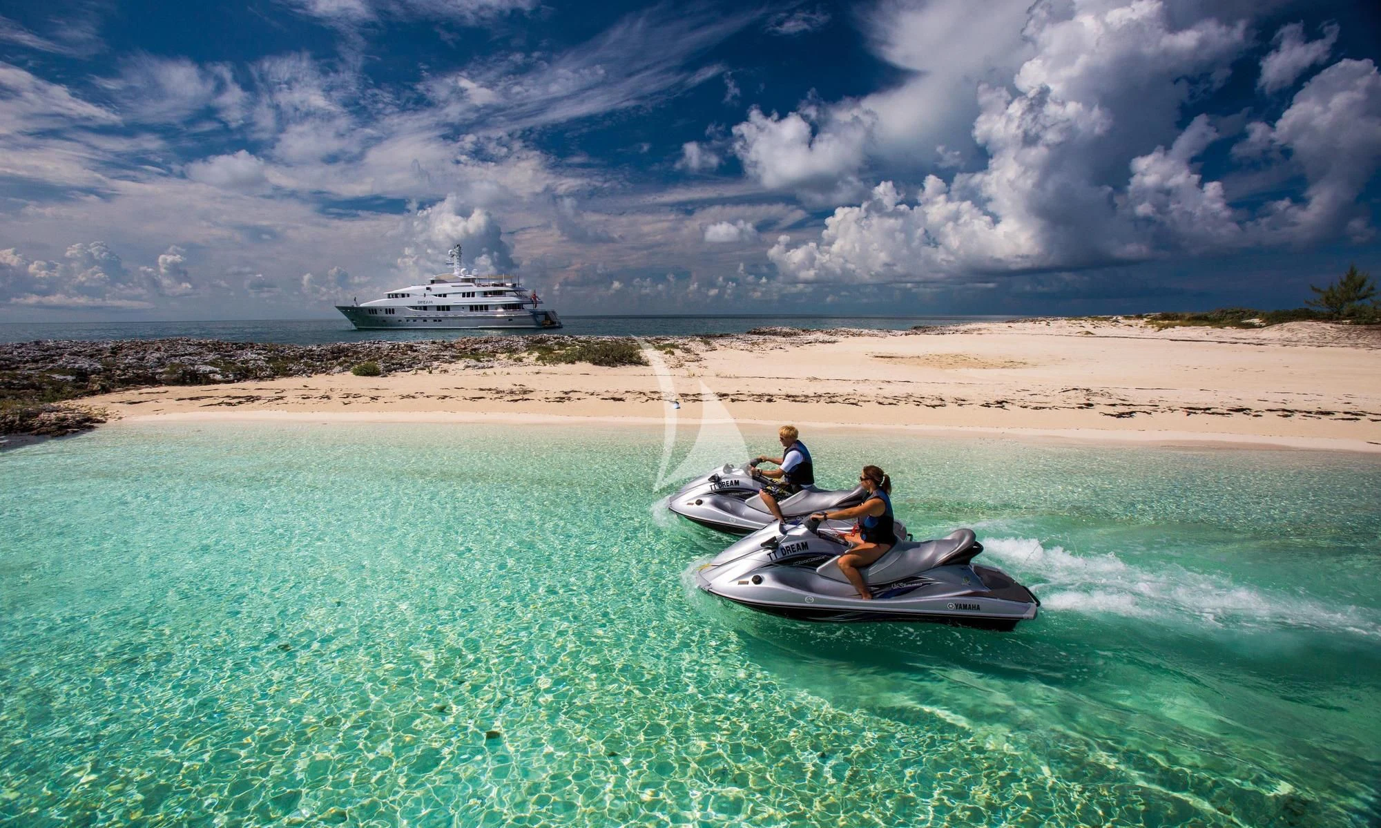 a group of people in a boat in the water aboard DREAM Yacht for Sale
