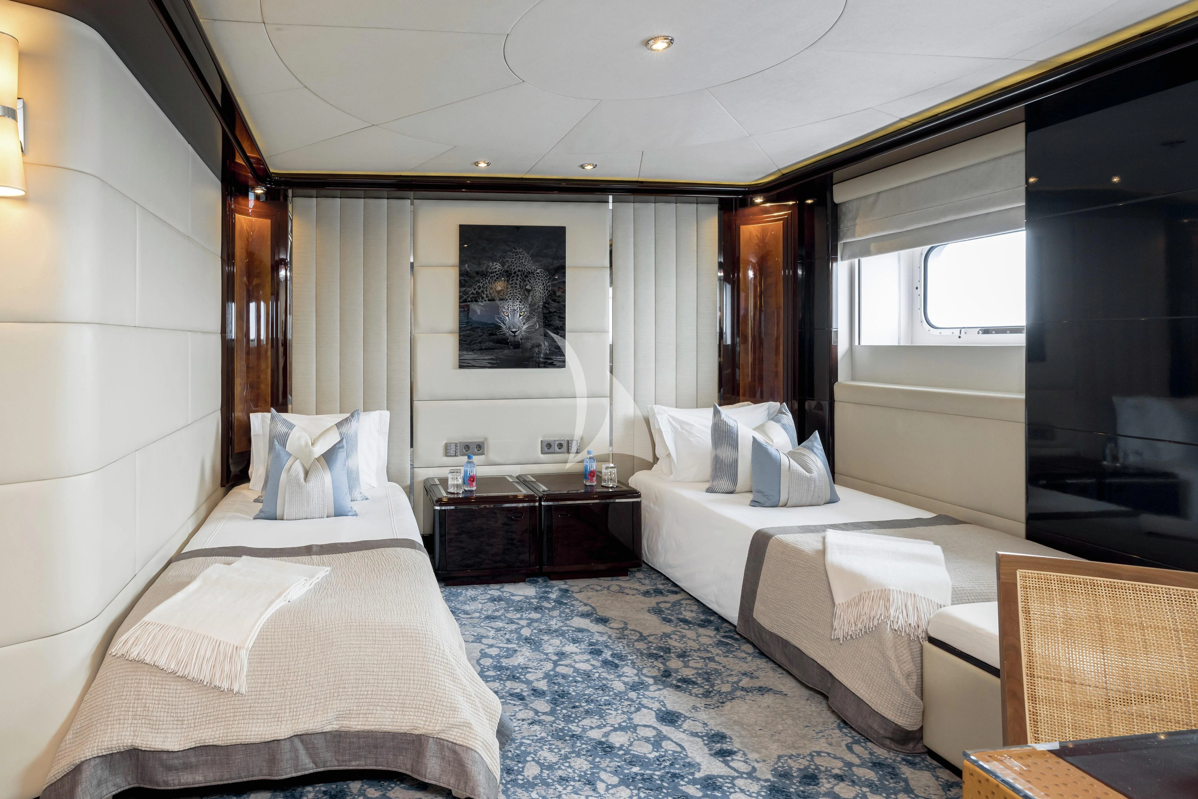 a room with a couple of beds aboard DREAM Yacht for Sale