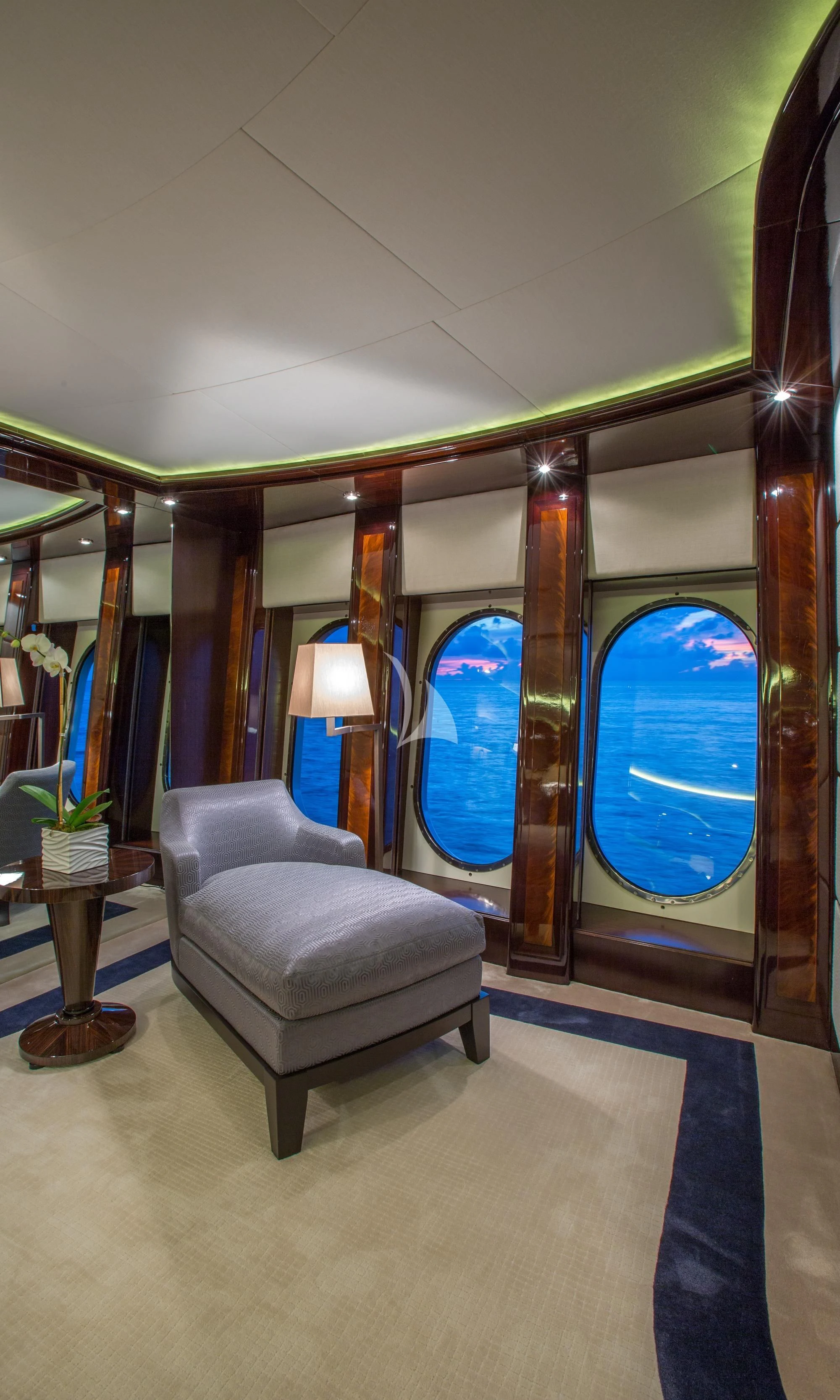 a room with a couch and a window aboard DREAM Yacht for Sale
