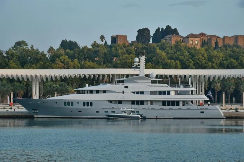 a large white boat on the water aboard DREAM Yacht for Sale