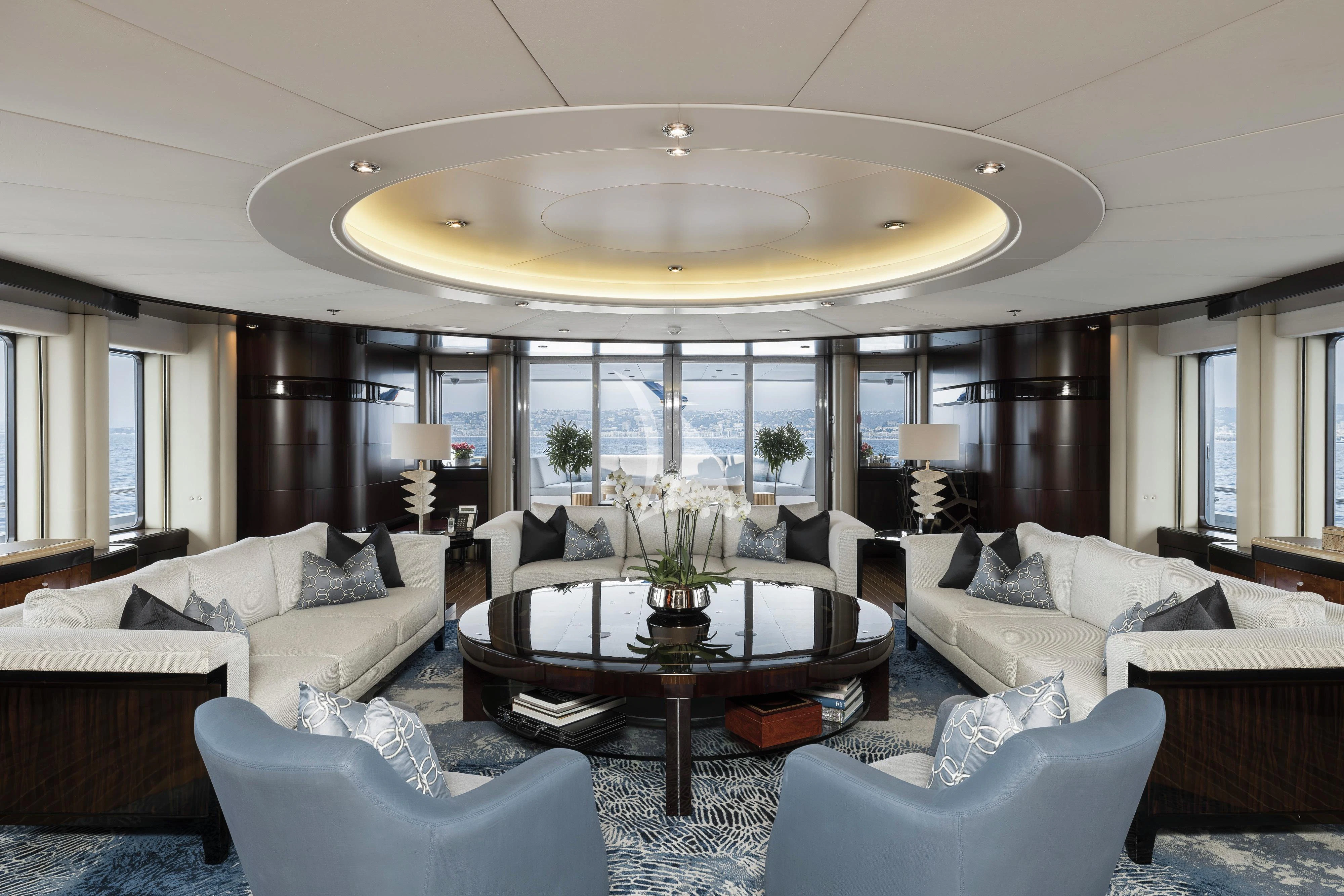 a large living room with a large glass ceiling aboard DREAM Yacht for Sale