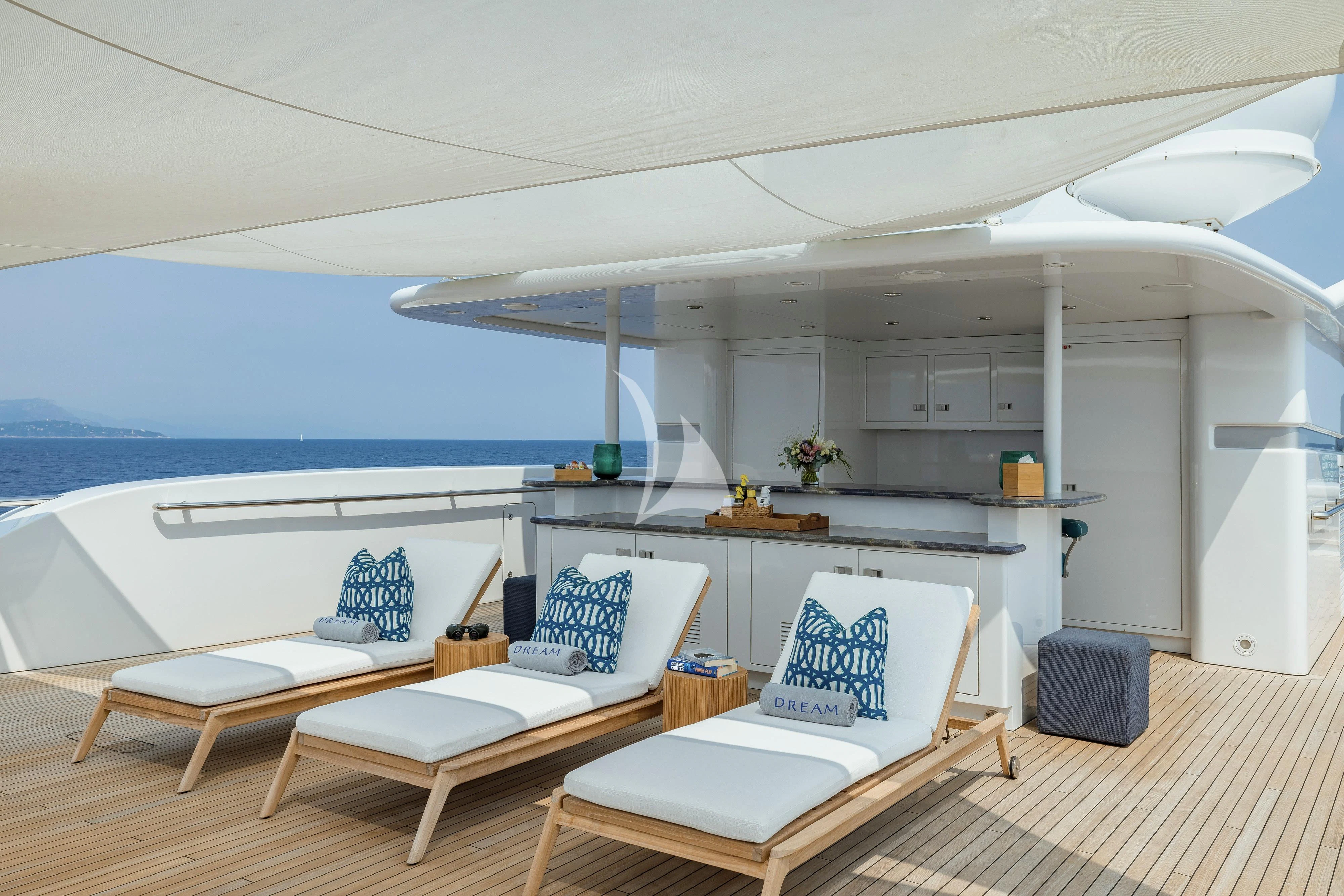 a room with a bed and a table aboard DREAM Yacht for Sale