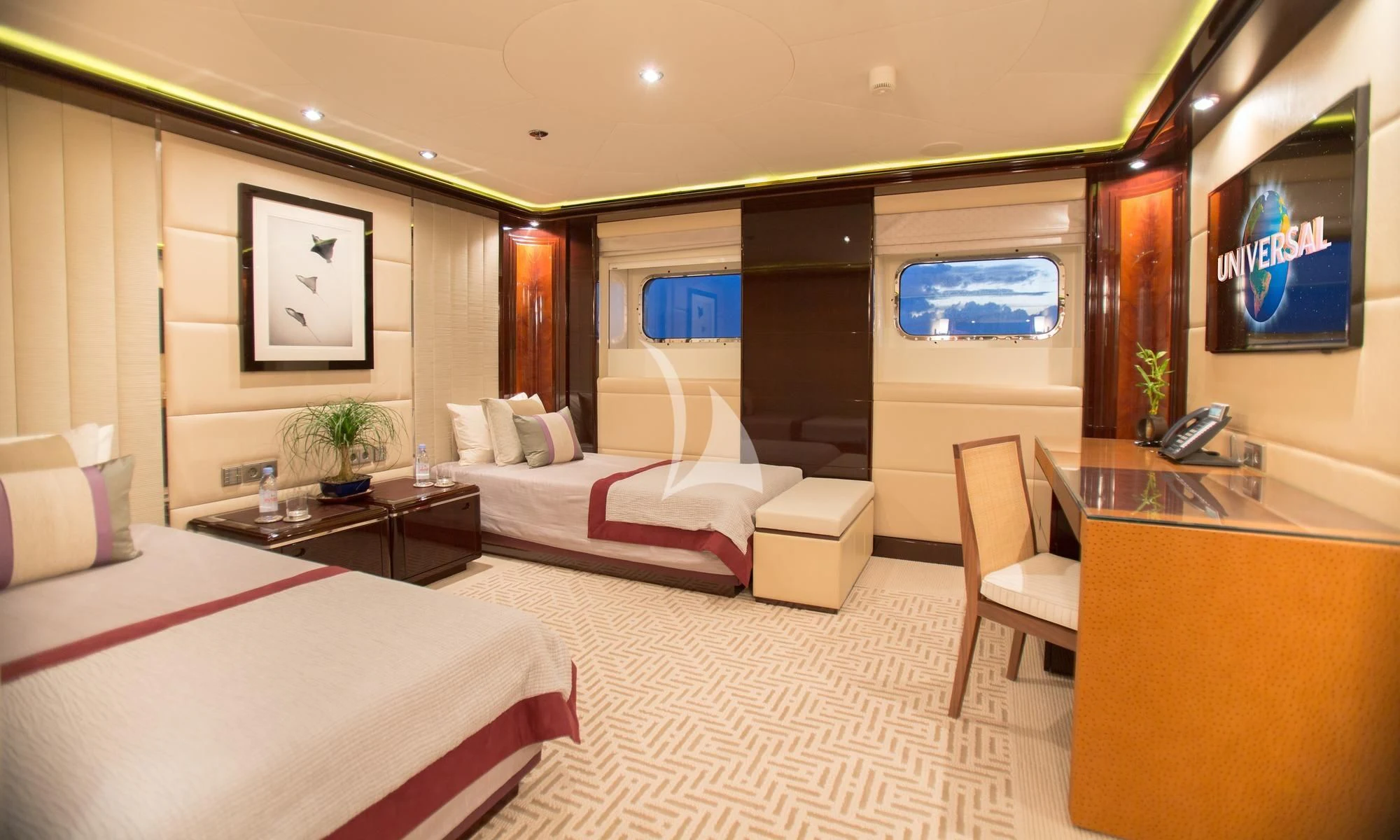 a room with a bed and a desk aboard DREAM Yacht for Sale