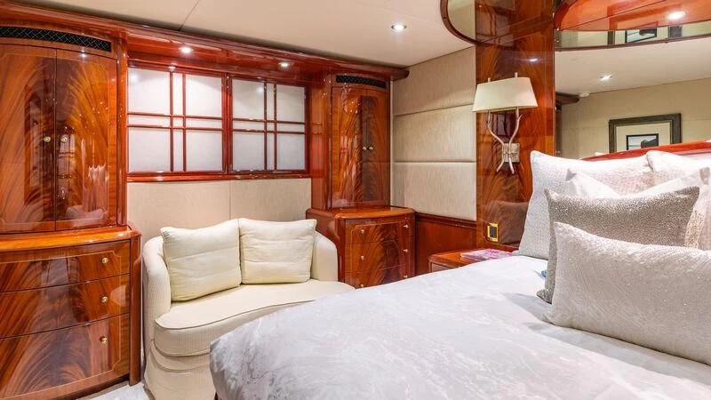 a bed with white sheets and pillows aboard HOPE FLOATS Yacht for Sale