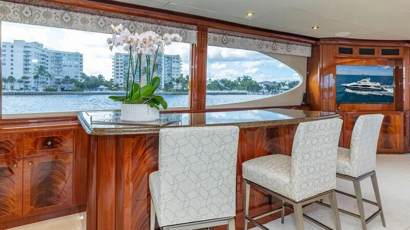 a room with a table and chairs aboard HOPE FLOATS Yacht for Sale