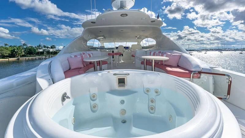 a white boat on a body of water aboard HOPE FLOATS Yacht for Sale