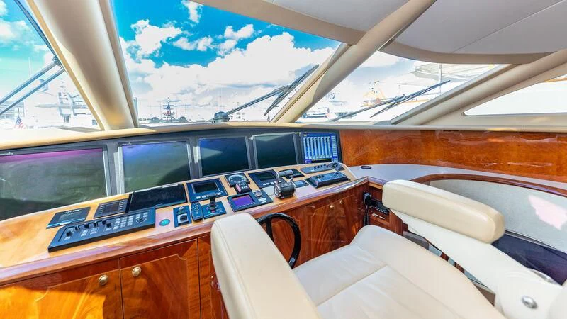 a room with a piano and a window aboard HOPE FLOATS Yacht for Sale