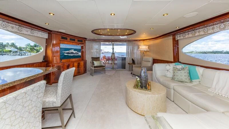 a living room with a large window aboard HOPE FLOATS Yacht for Sale