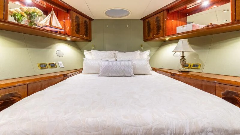 a bed with white sheets aboard HOPE FLOATS Yacht for Sale