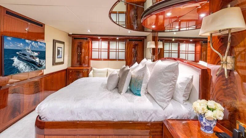 a bed with white pillows aboard HOPE FLOATS Yacht for Sale
