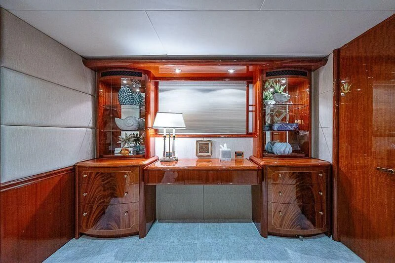 a room with a desk and a mirror aboard HOPE FLOATS Yacht for Sale