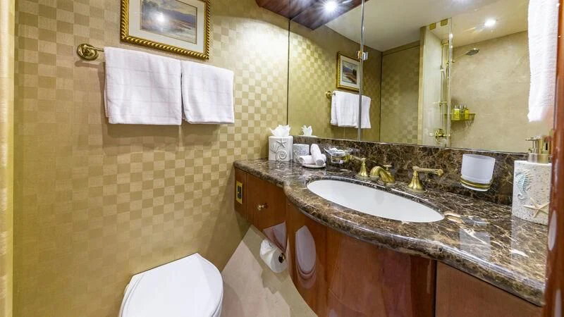 a bathroom with a large mirror aboard HOPE FLOATS Yacht for Sale