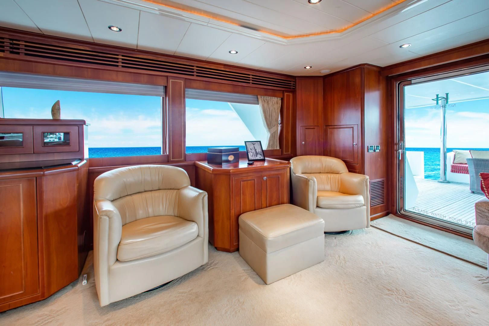 a living room with a large window aboard BOXES II Yacht for Sale