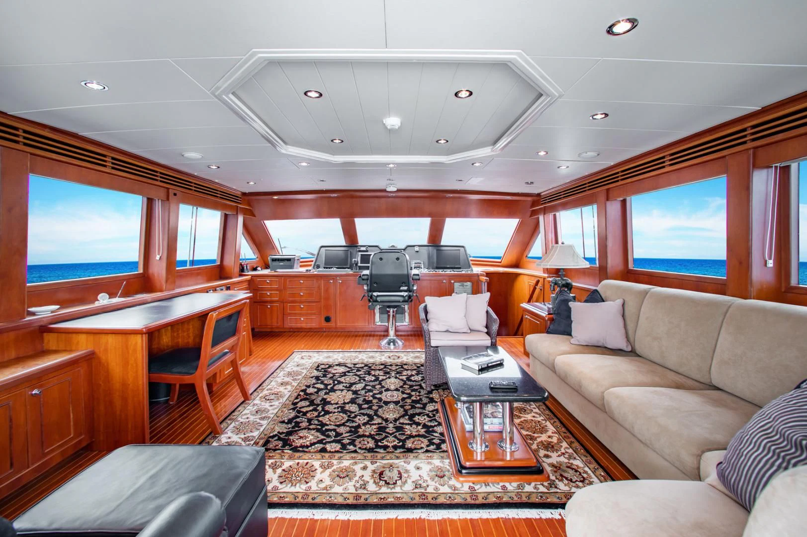 a living room with a large window aboard BOXES II Yacht for Sale