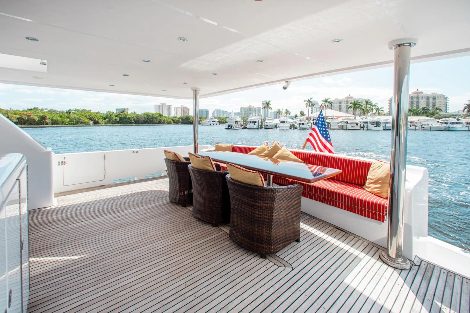 a deck with chairs and a large body of water aboard BOXES II Yacht for Sale