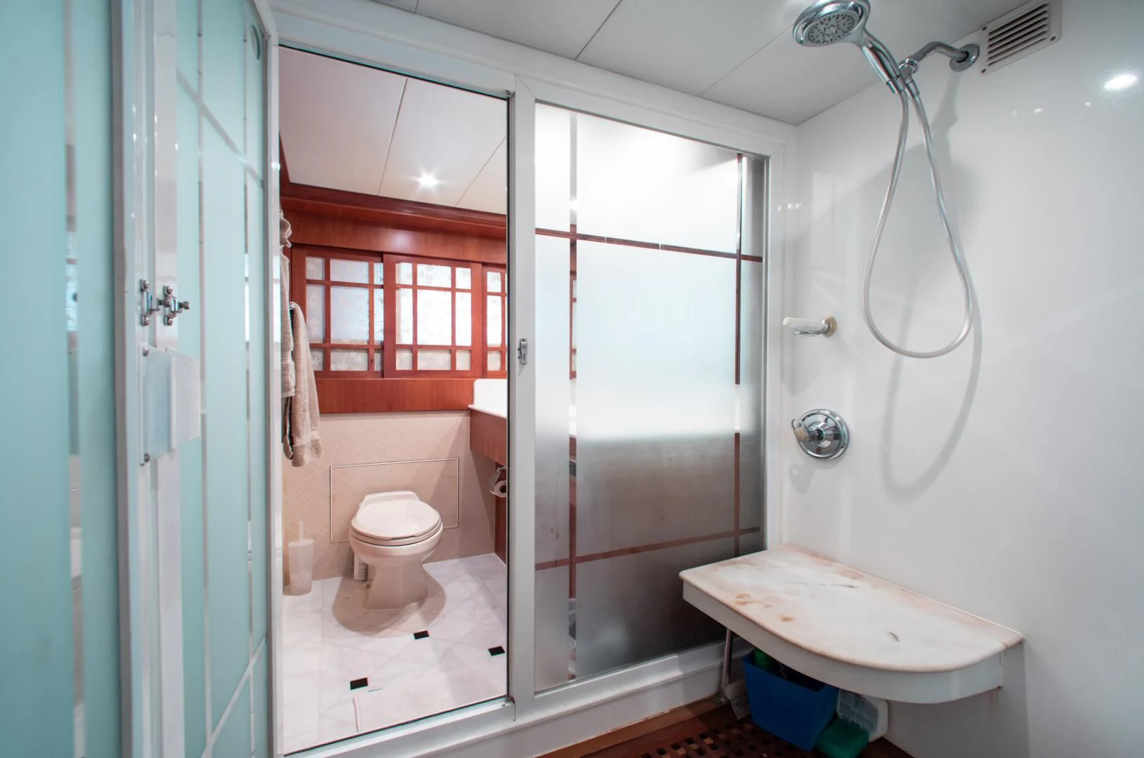 a bathroom with a sink toilet and shower aboard BOXES II Yacht for Sale