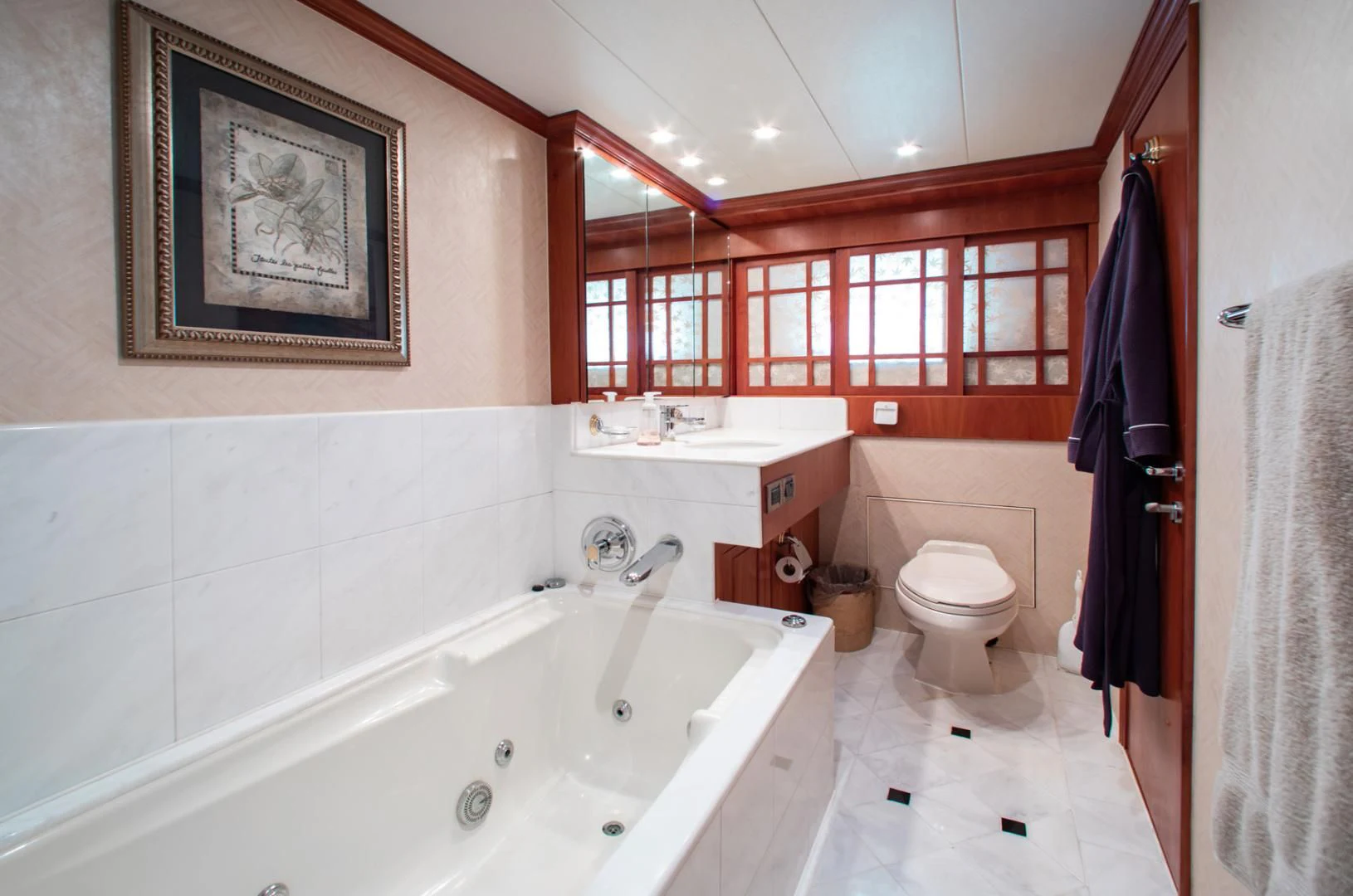 a bathroom with a bathtub and toilet aboard BOXES II Yacht for Sale