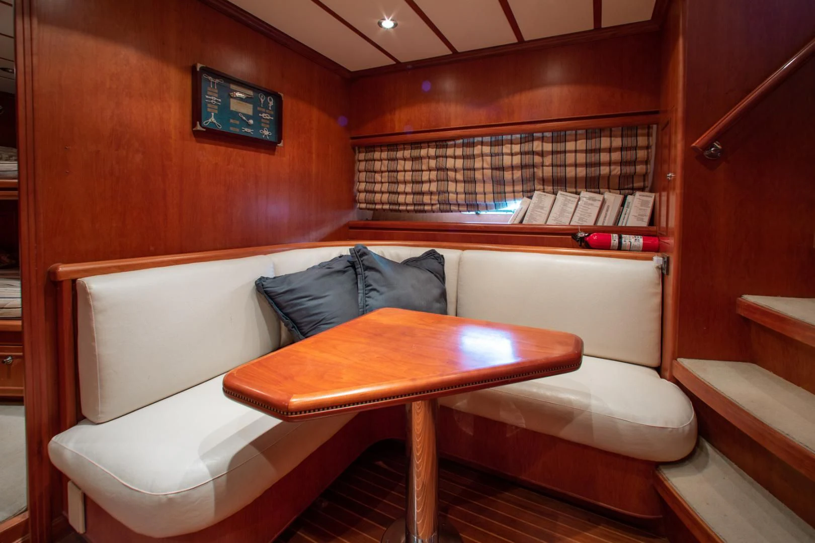 a room with a bed and a table aboard BOXES II Yacht for Sale