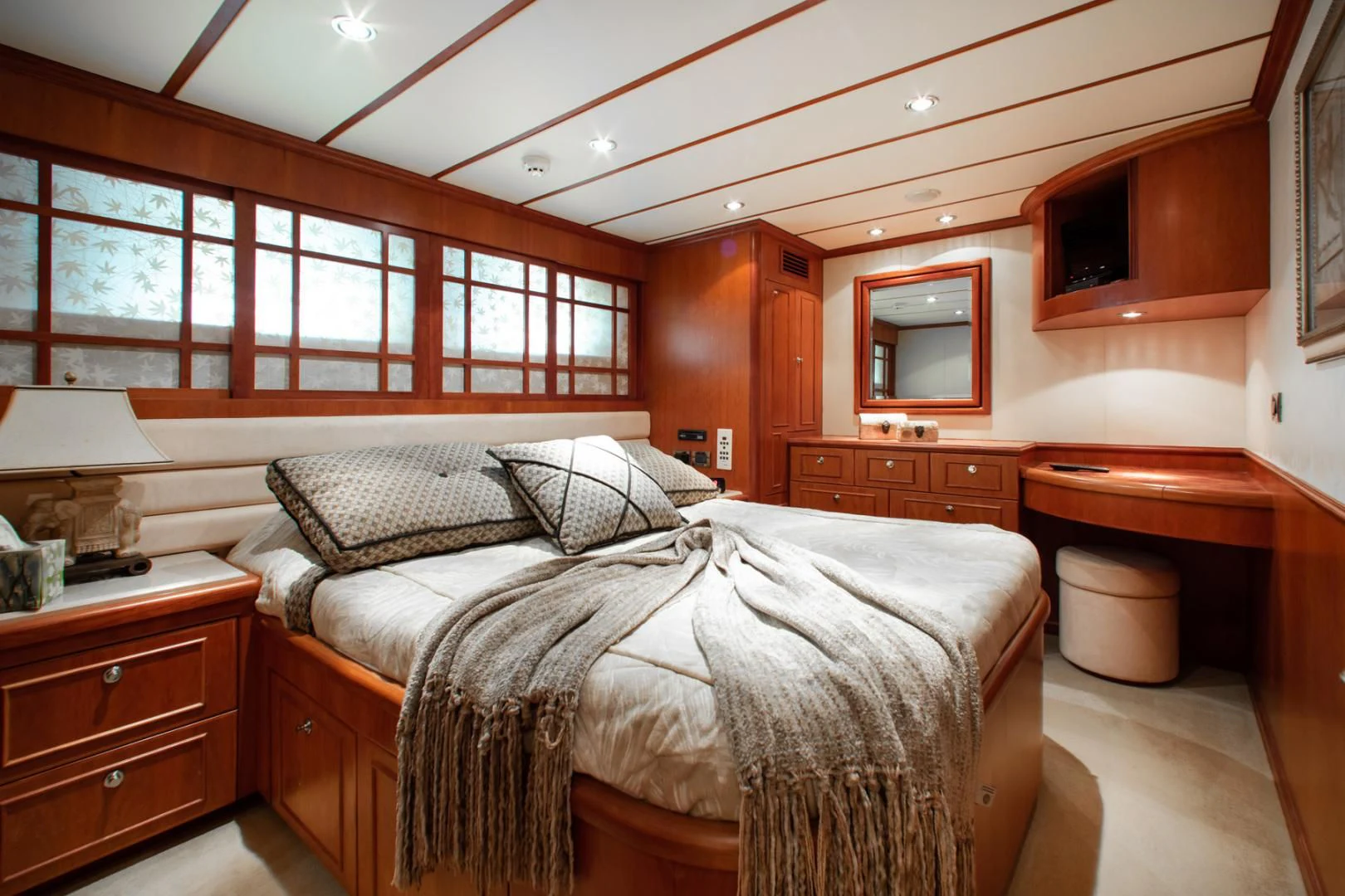 a bedroom with a large bed aboard BOXES II Yacht for Sale