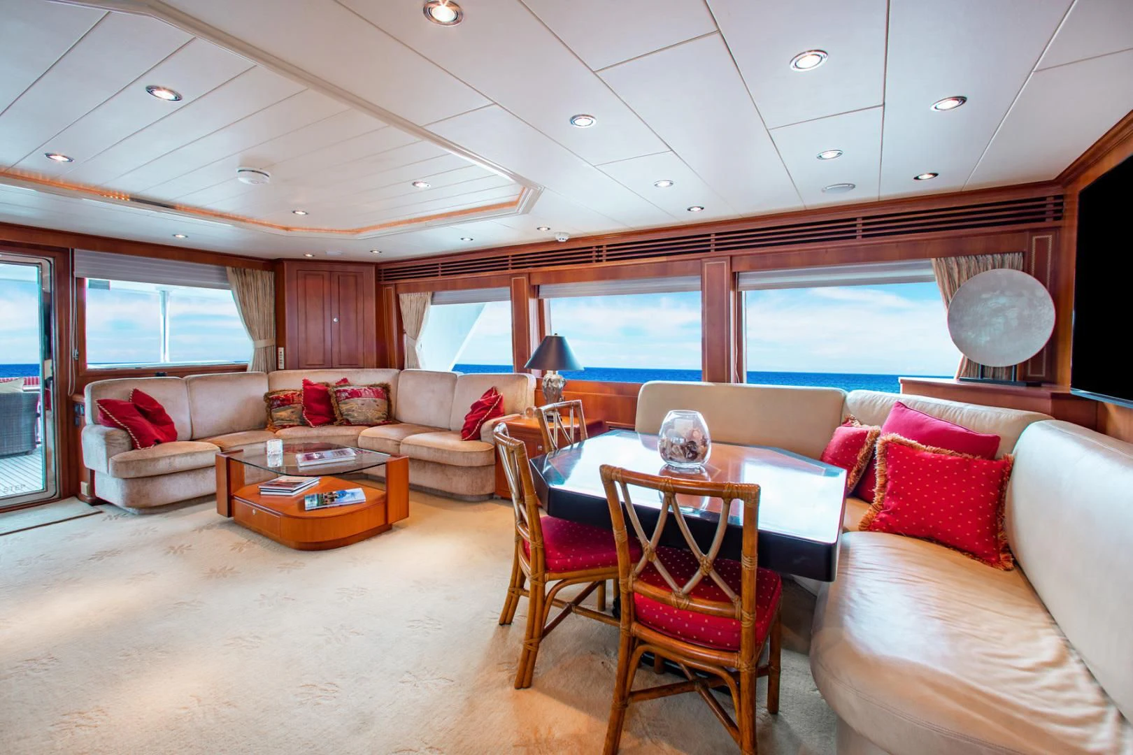 a living room with a table and chairs aboard BOXES II Yacht for Sale