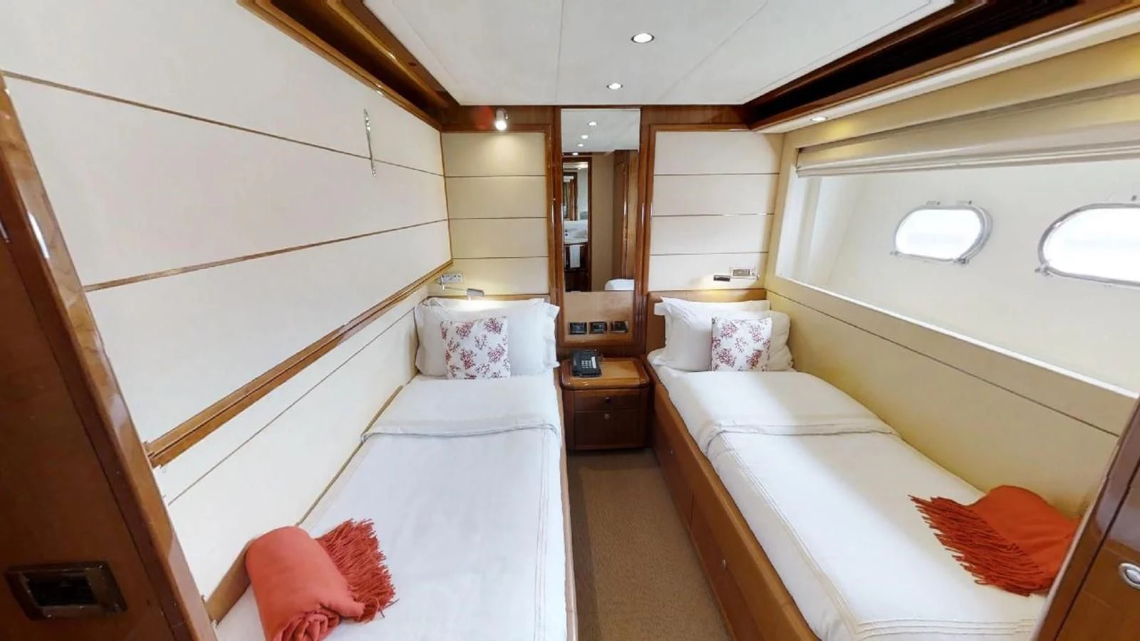 a room with two beds aboard INDULGE II Yacht for Sale