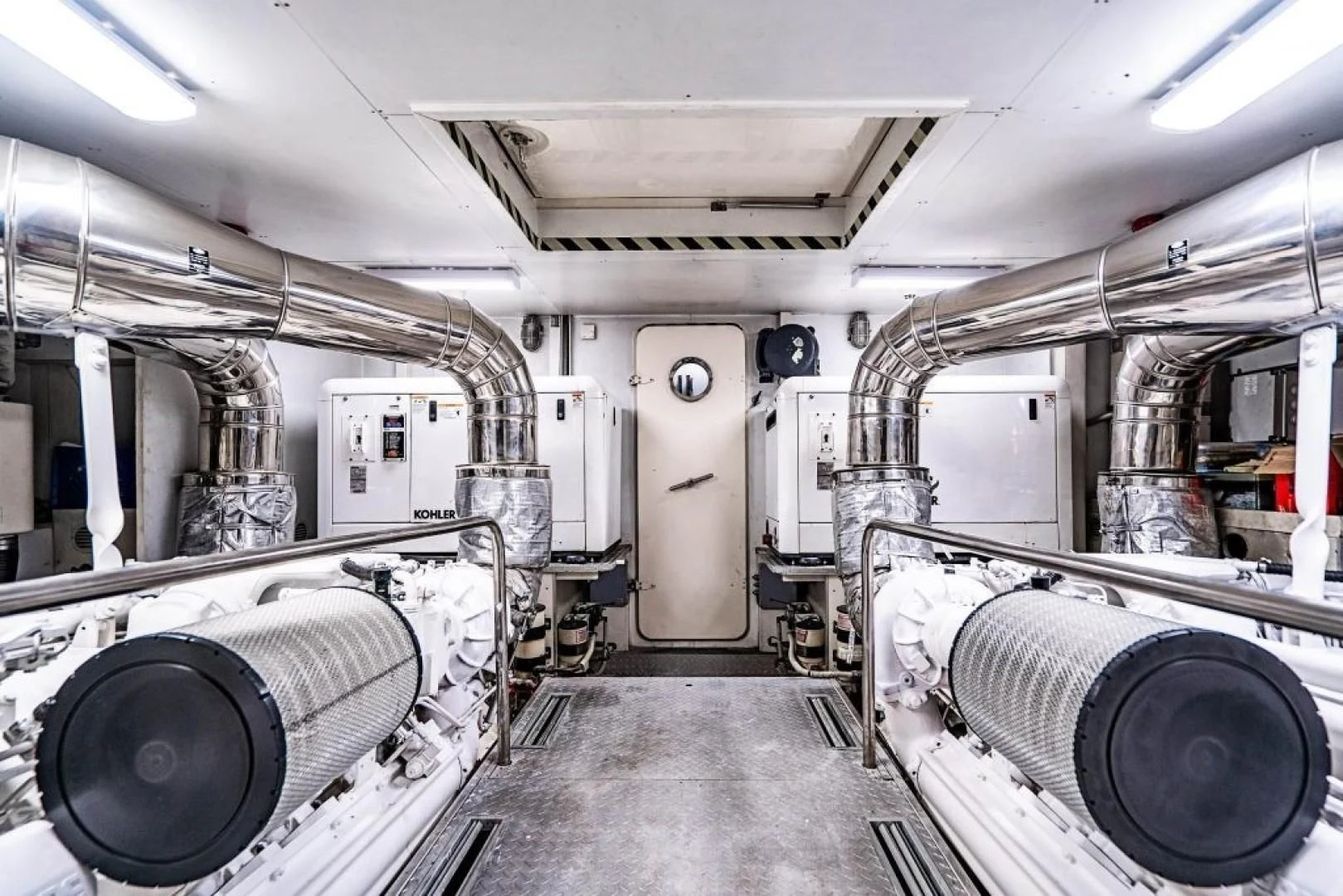 a room with large pipes aboard INDULGE II Yacht for Sale