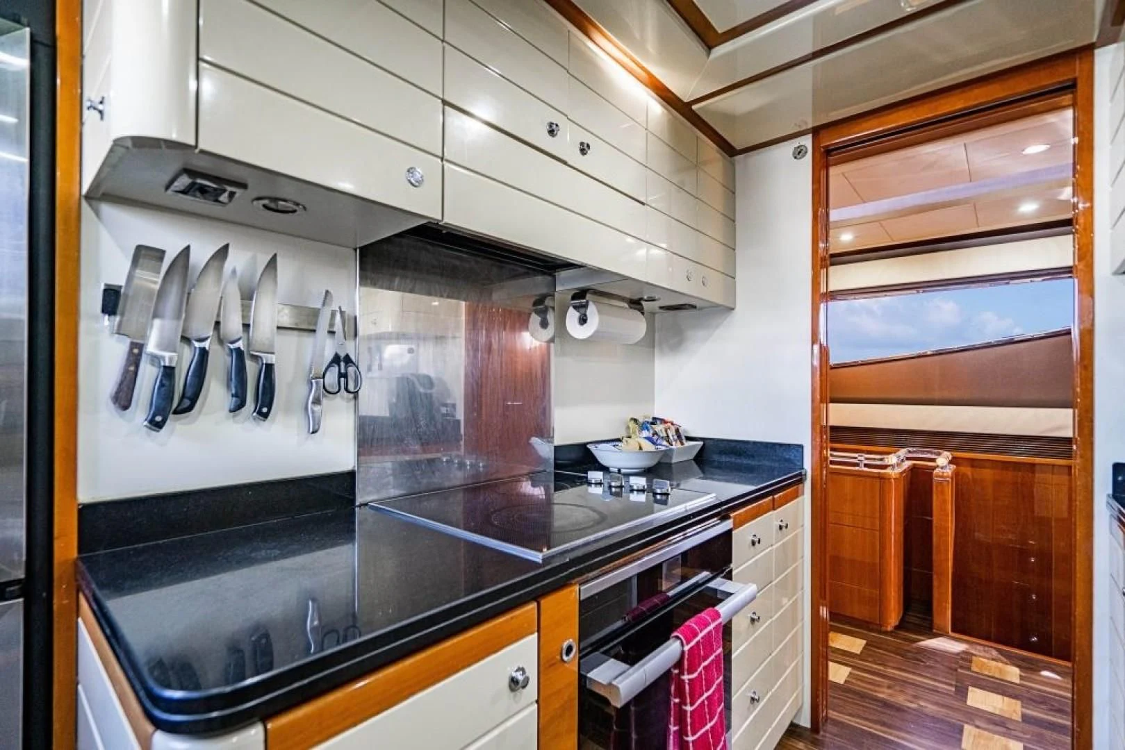 a kitchen with a stove and oven aboard INDULGE II Yacht for Sale
