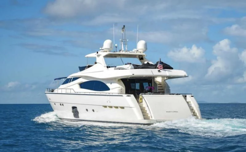 a white boat in the water aboard INDULGE II Yacht for Sale