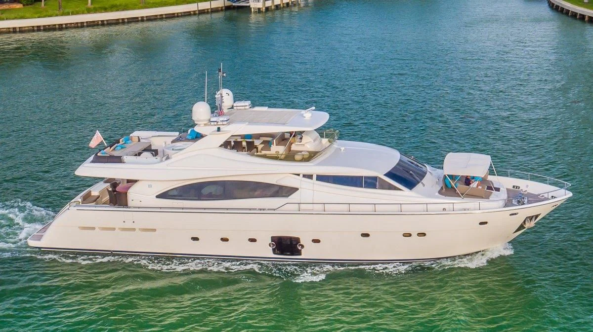 a white yacht on the water aboard INDULGE II Yacht for Sale