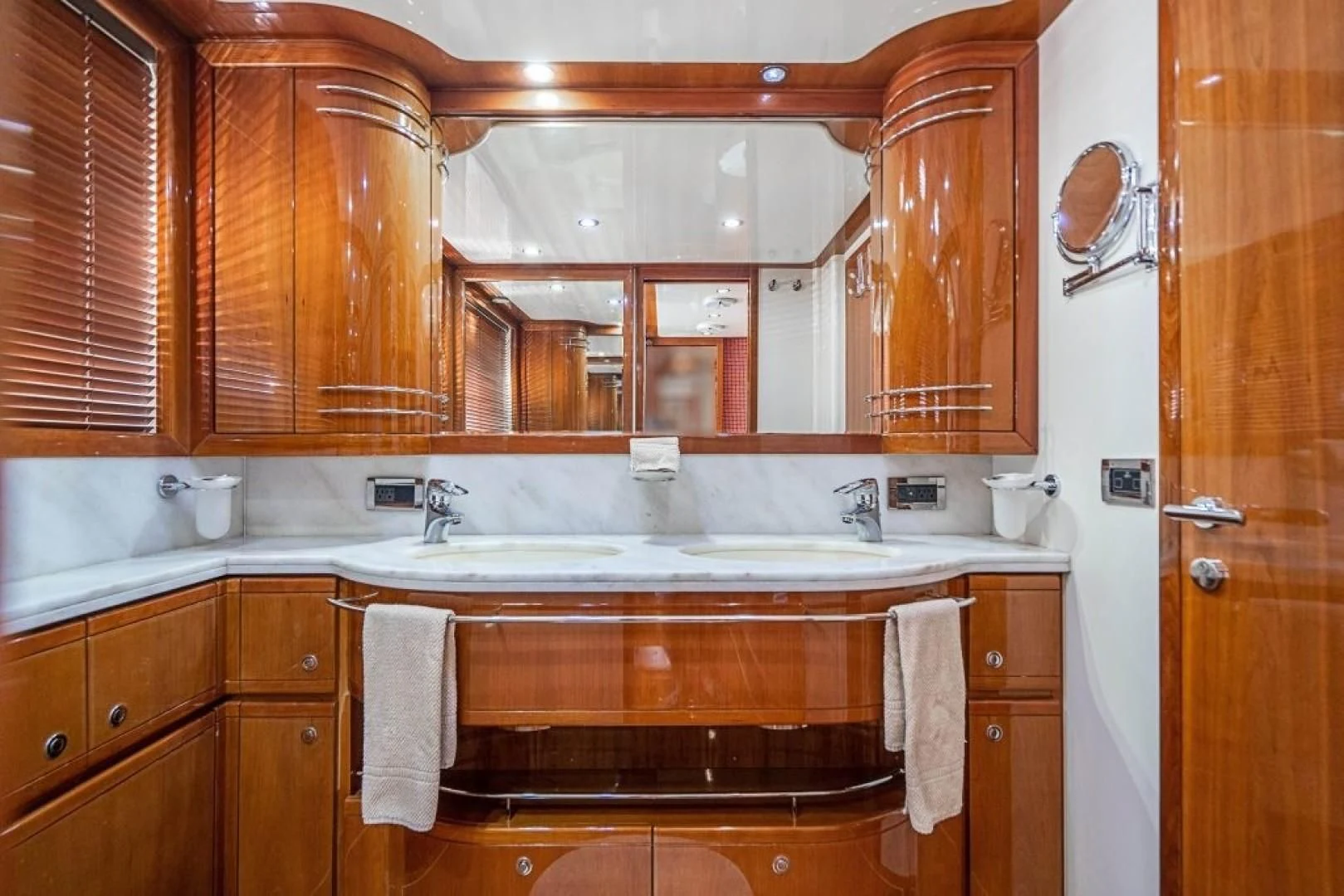 a kitchen with wooden cabinets aboard INDULGE II Yacht for Sale