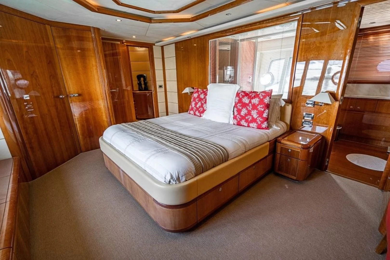 a bed in a room aboard INDULGE II Yacht for Sale