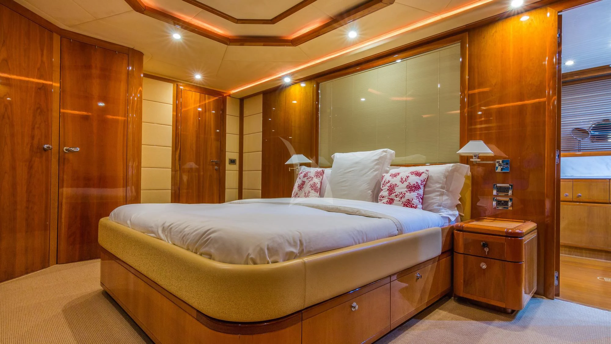 a bed in a room aboard INDULGE II Yacht for Sale