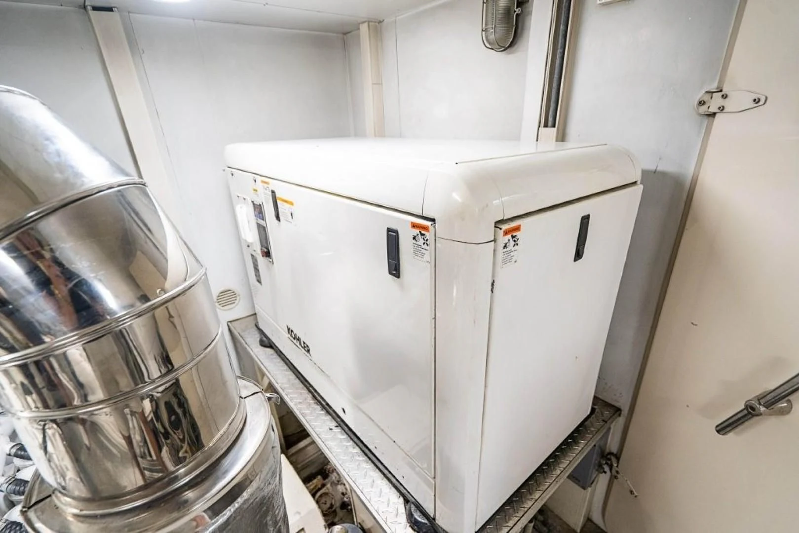 a machine in a room aboard INDULGE II Yacht for Sale