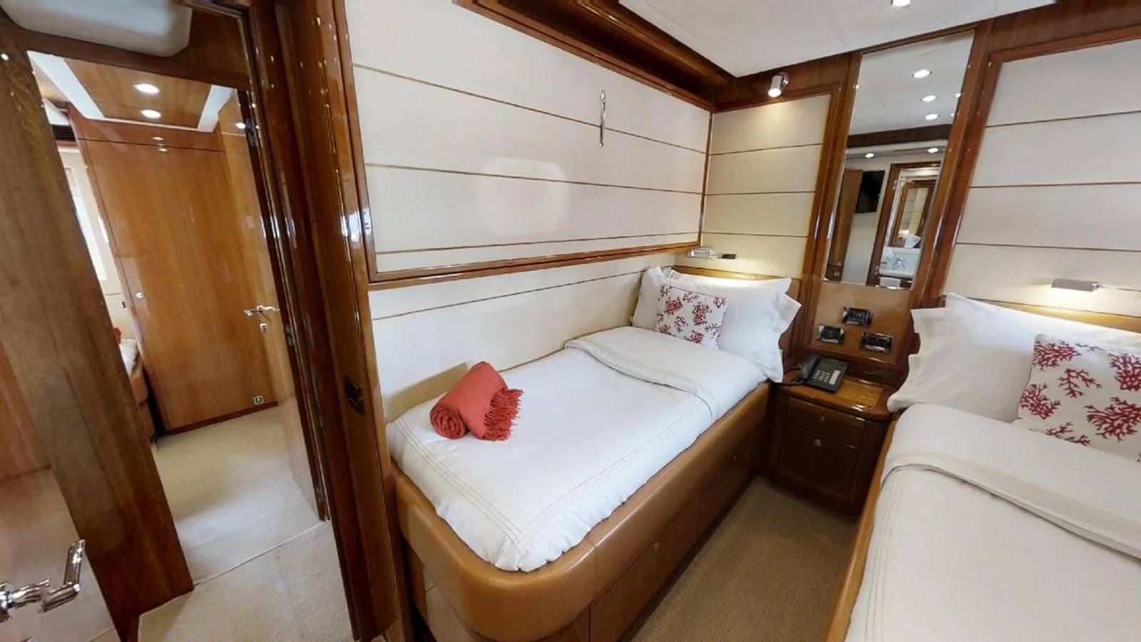a room with two beds aboard INDULGE II Yacht for Sale