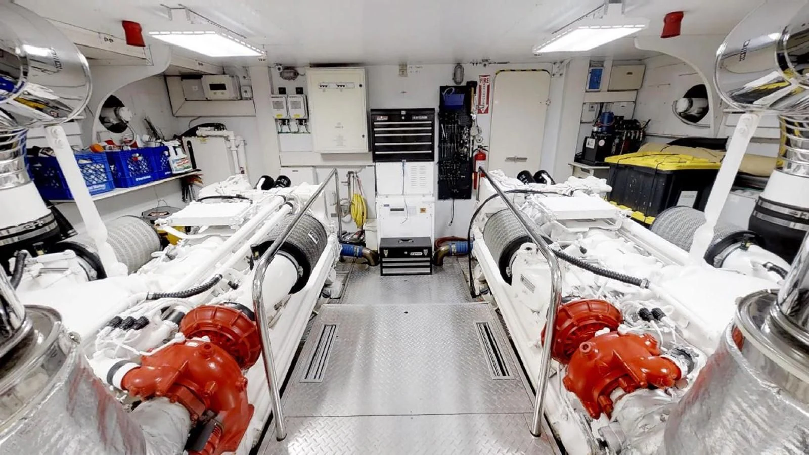 a room with white walls and red and white machinery aboard INDULGE II Yacht for Sale
