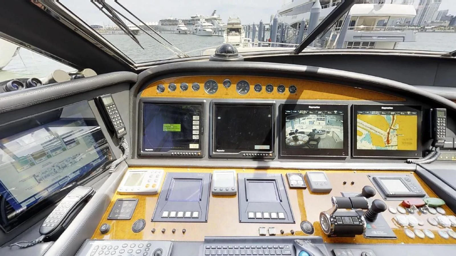 the inside of a yellow vehicle aboard INDULGE II Yacht for Sale