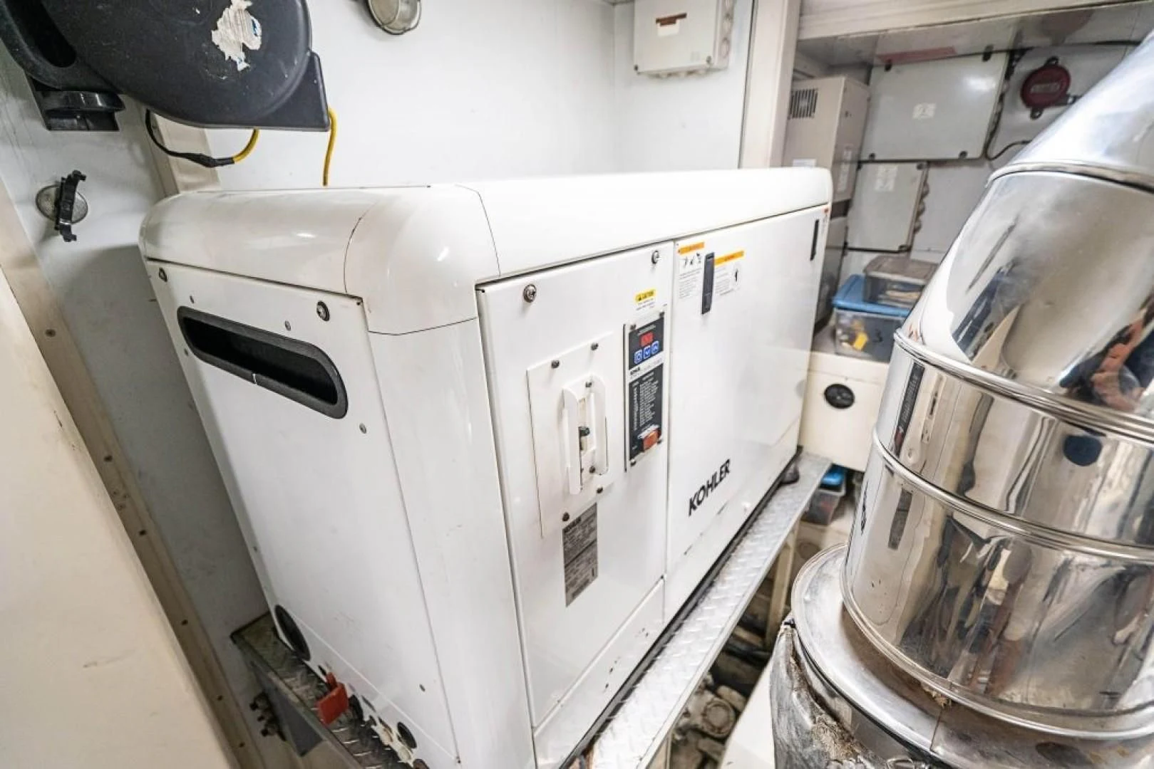 a white machine with a black handle aboard INDULGE II Yacht for Sale