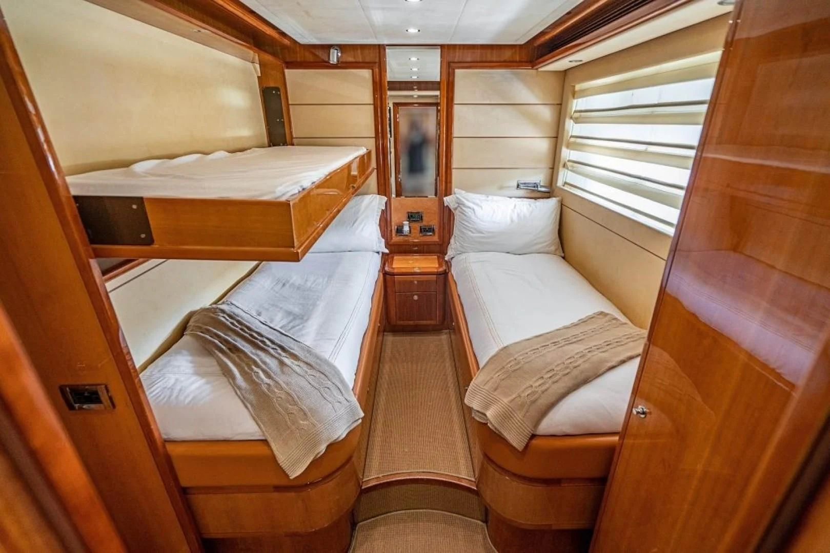 a room with bunk beds aboard INDULGE II Yacht for Sale