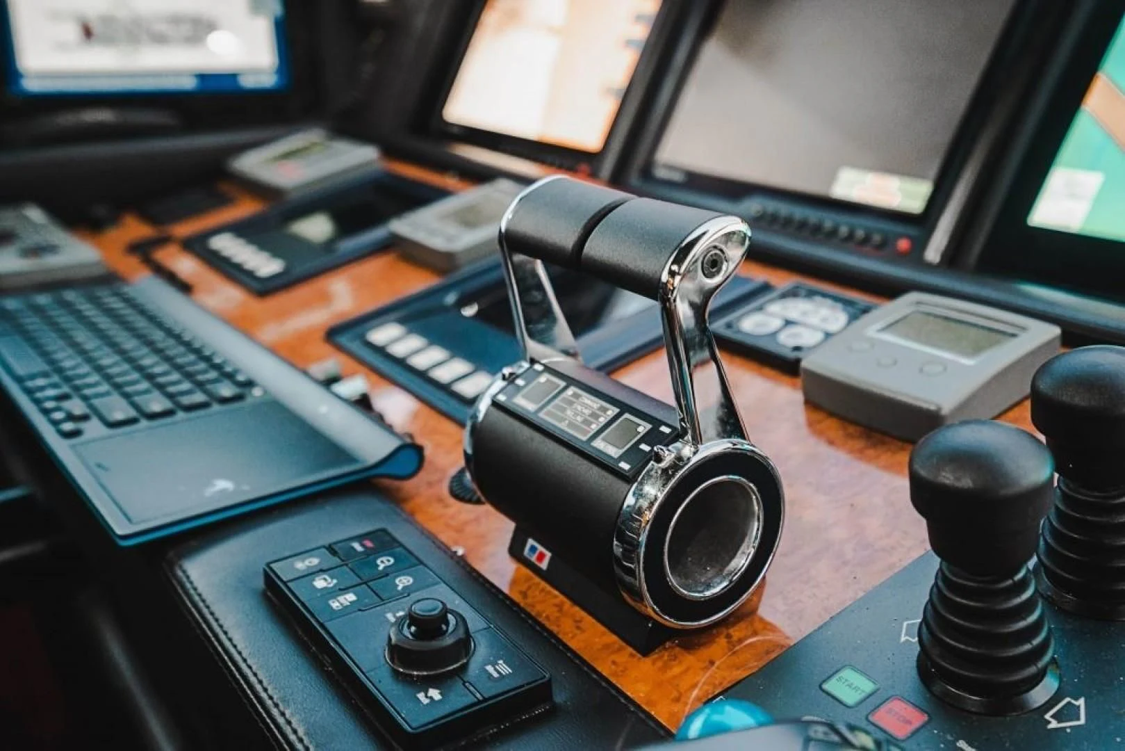 a black camera on a desk aboard INDULGE II Yacht for Sale