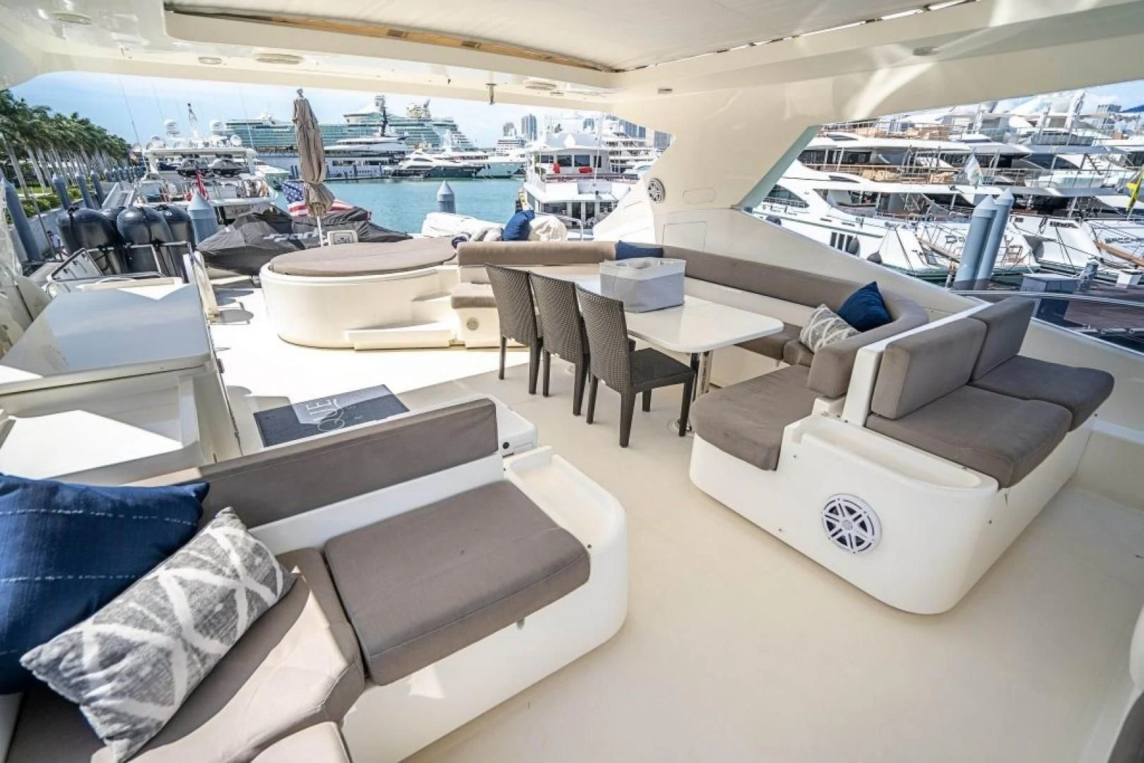 a room with a pool and lounge chairs aboard INDULGE II Yacht for Sale
