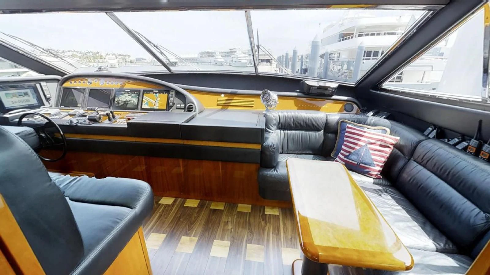 inside of a car aboard INDULGE II Yacht for Sale