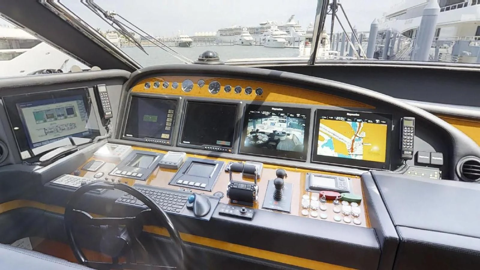 inside of a yellow vehicle aboard INDULGE II Yacht for Sale
