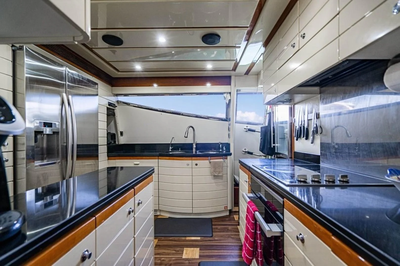 a kitchen with stainless steel appliances aboard INDULGE II Yacht for Sale