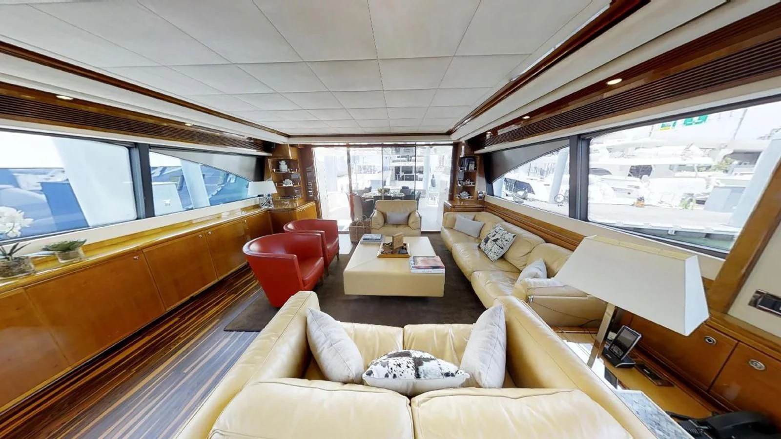 a living room with a large window aboard INDULGE II Yacht for Sale