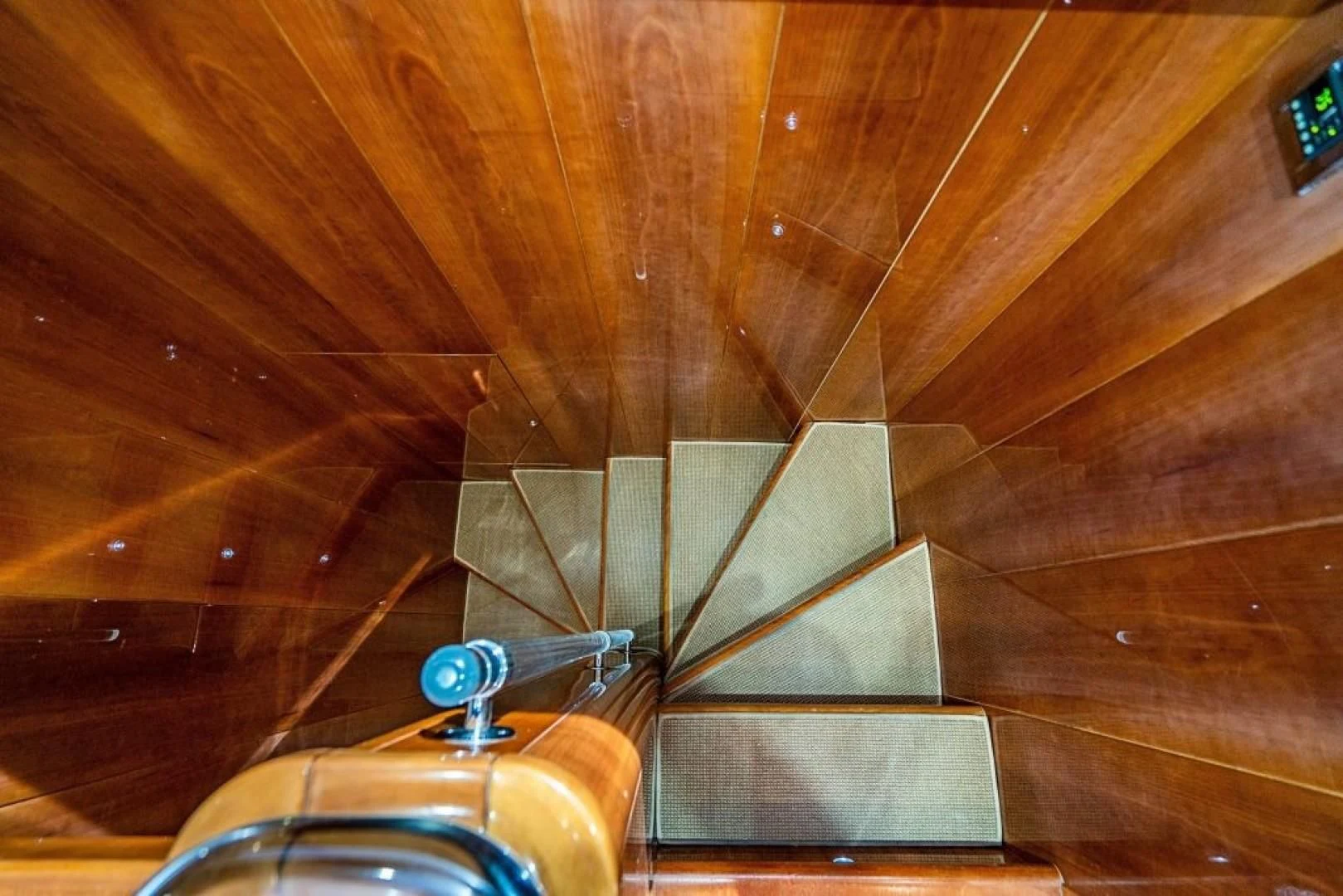 a metal object on a wooden surface aboard INDULGE II Yacht for Sale