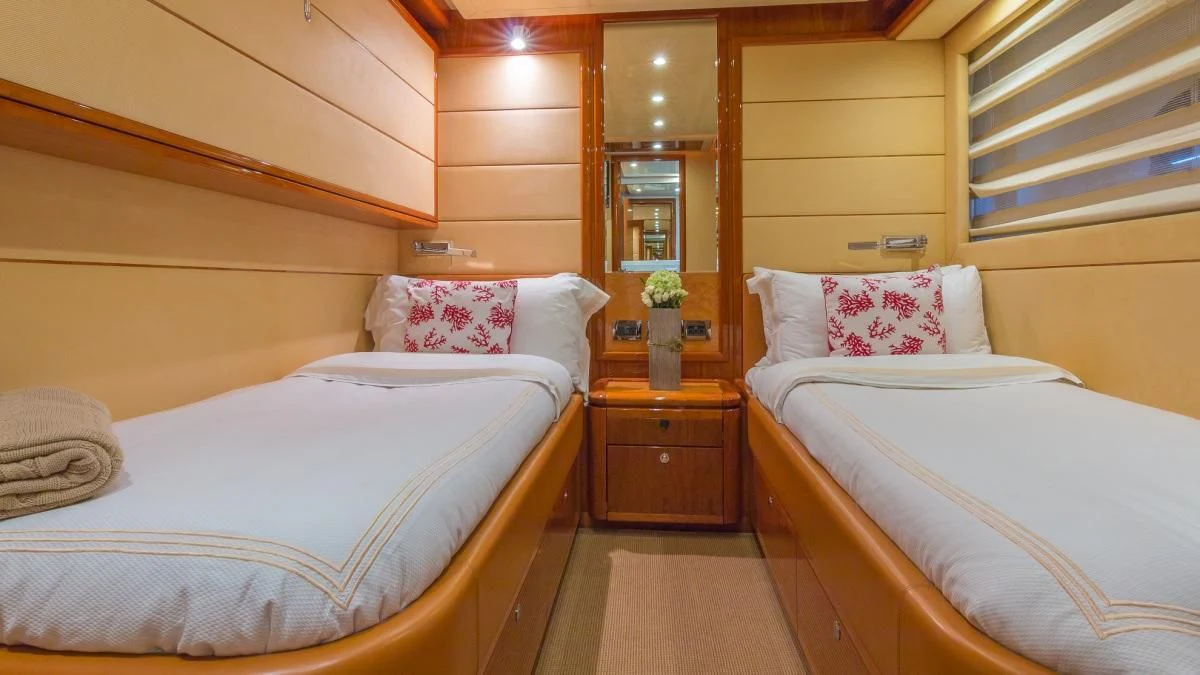 a couple of beds in a room aboard INDULGE II Yacht for Sale