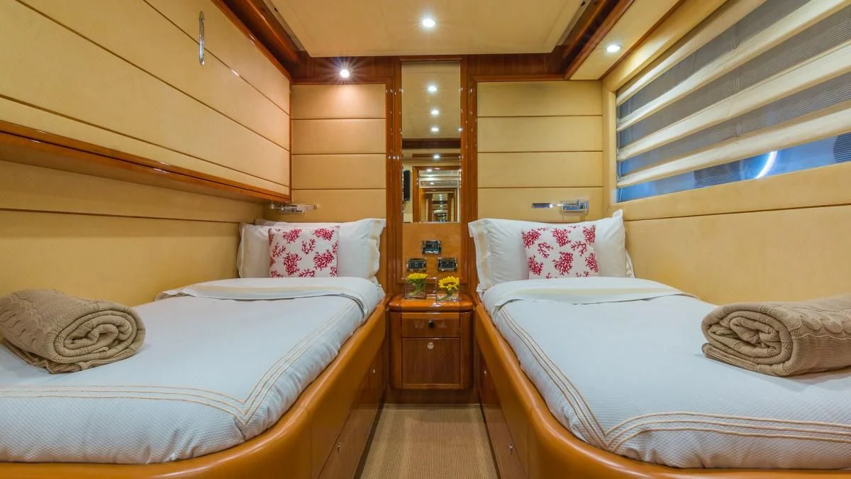 a couple of beds in a room aboard INDULGE II Yacht for Sale